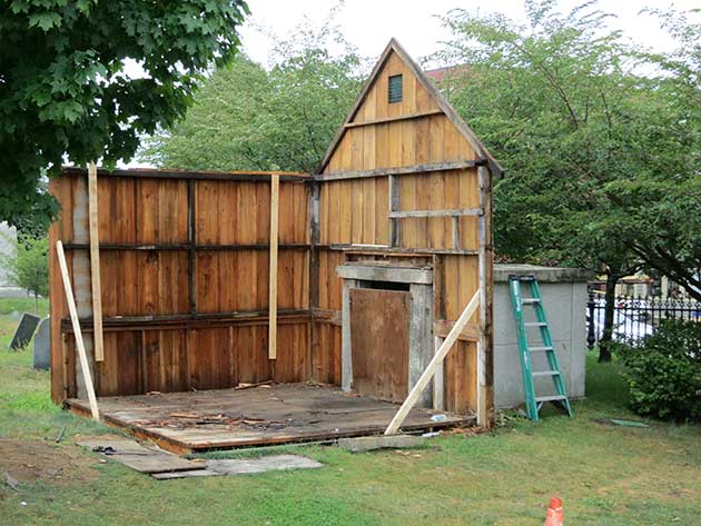 back and side of deconstructed dead house