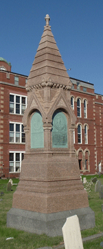 trimming around monuments in the cemetery