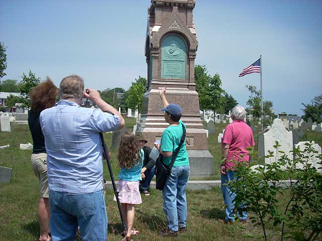 Barb points at Alden monument