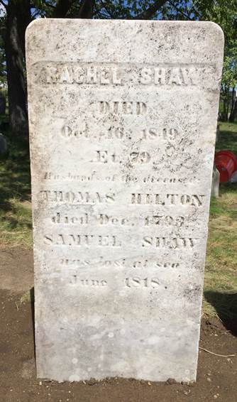 Newly reset in rich brown sod, a clean marble rectangular grave marker for Rachel Shaw. Text transcription follows