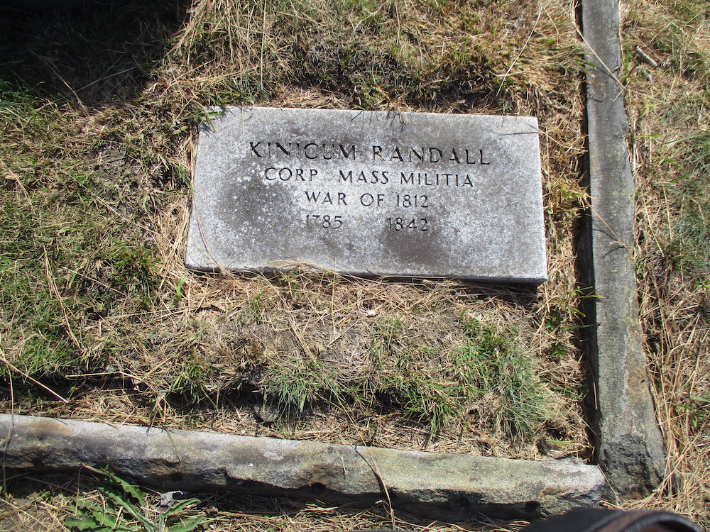 old granite grave marker for Kinicum Randall
