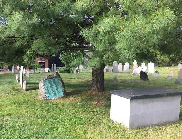 boulder and Smith box tomb under the pine tree